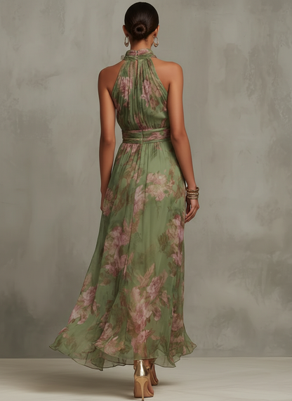 Women's green floral halter maxi dress with a defined waist and flowing skirt