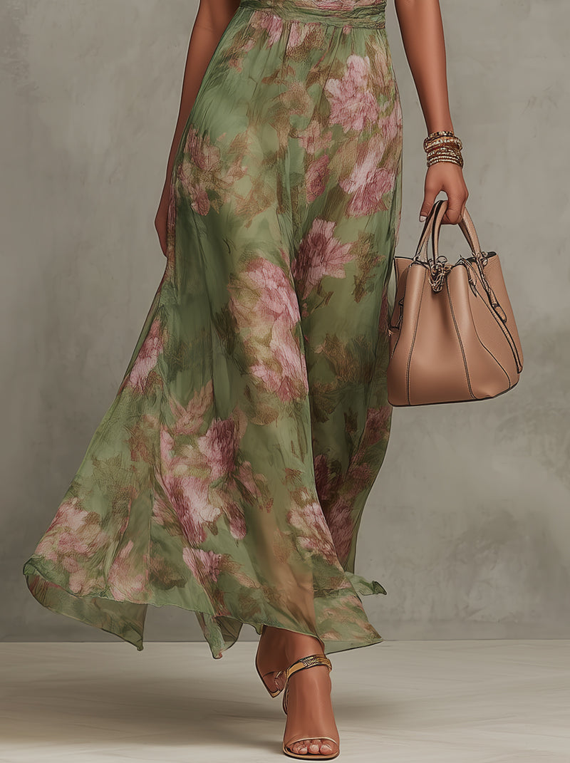 Women's green floral halter maxi dress with a defined waist and flowing skirt