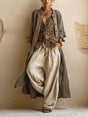 Women's camel three-piece outfit with long coat, patterned V-neck top and wide-leg trousers