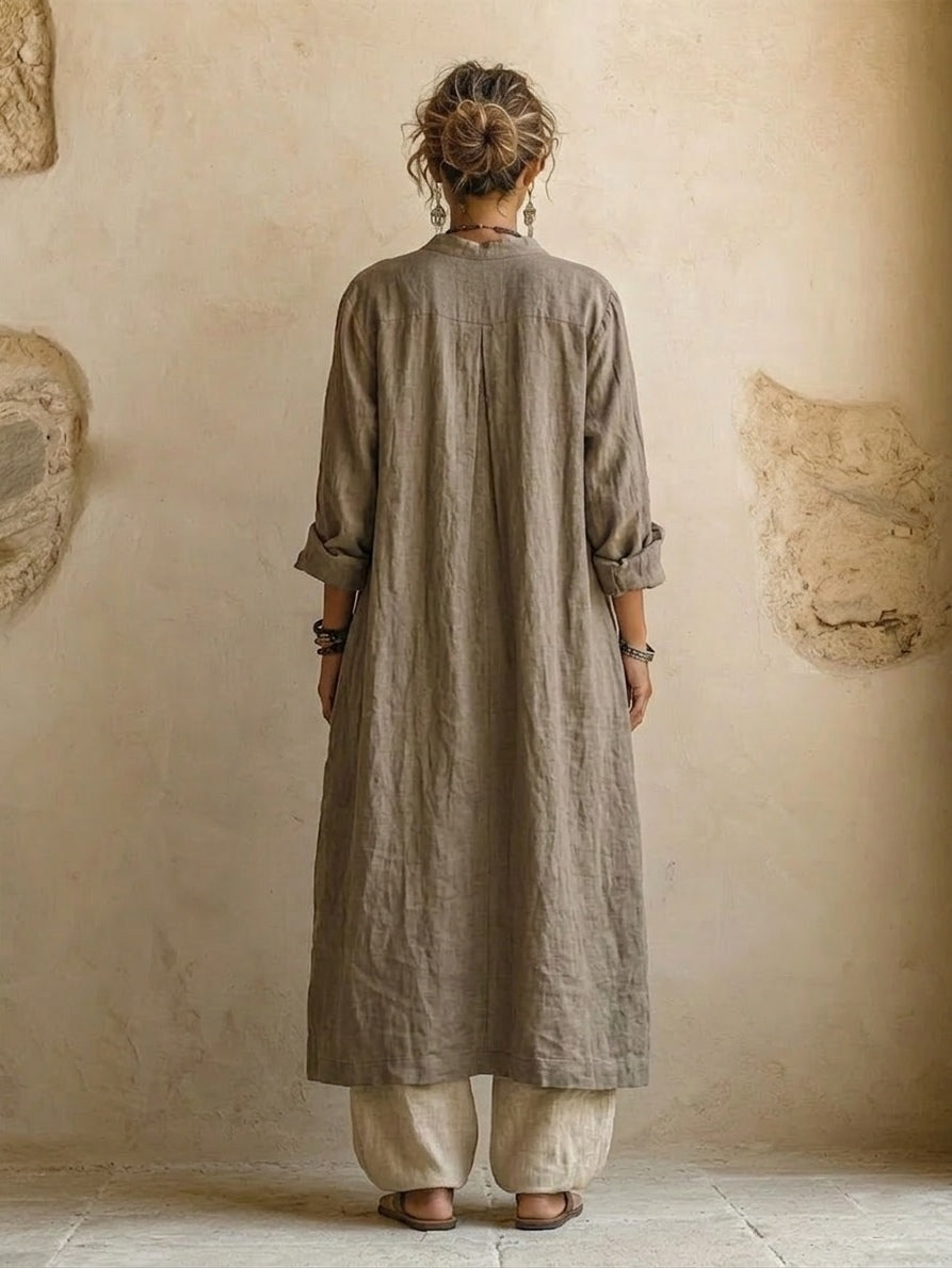 Women's camel three-piece outfit with long coat, patterned V-neck top and wide-leg trousers