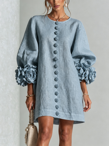 Women's round-neck mini dress with long sleeves, front buttons and oversized floral cuffs
