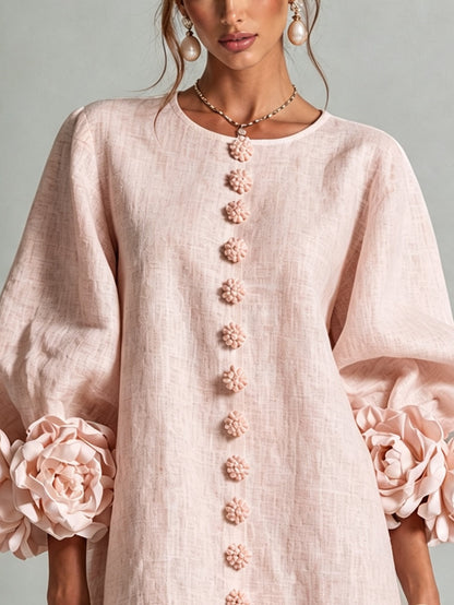 Women's pink mini dress with long sleeves, front buttons and large flower cuffs