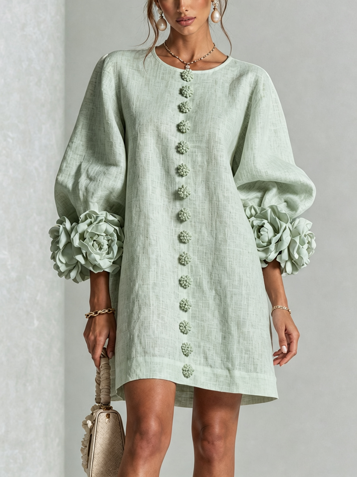 Women's round-neck mini dress with long sleeves, front buttons and oversized floral cuffs