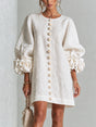 Women's round-neck mini dress with long sleeves, front buttons and oversized floral cuffs