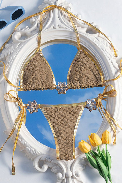 Women's textured two-piece bikini set with gold-tone trim and tie sides