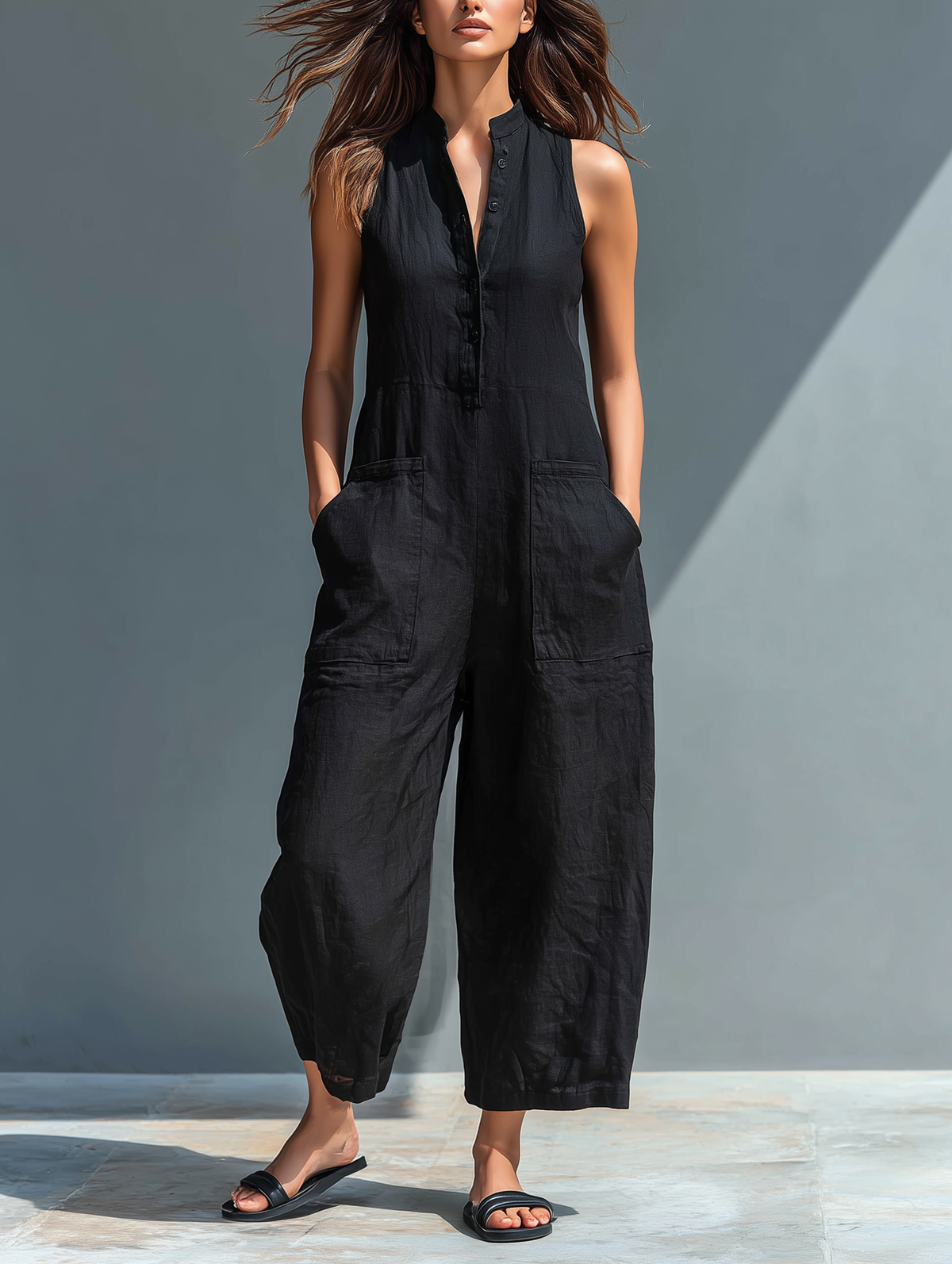 Women's sleeveless button-front utility jumpsuit with wide cropped legs and patch pockets