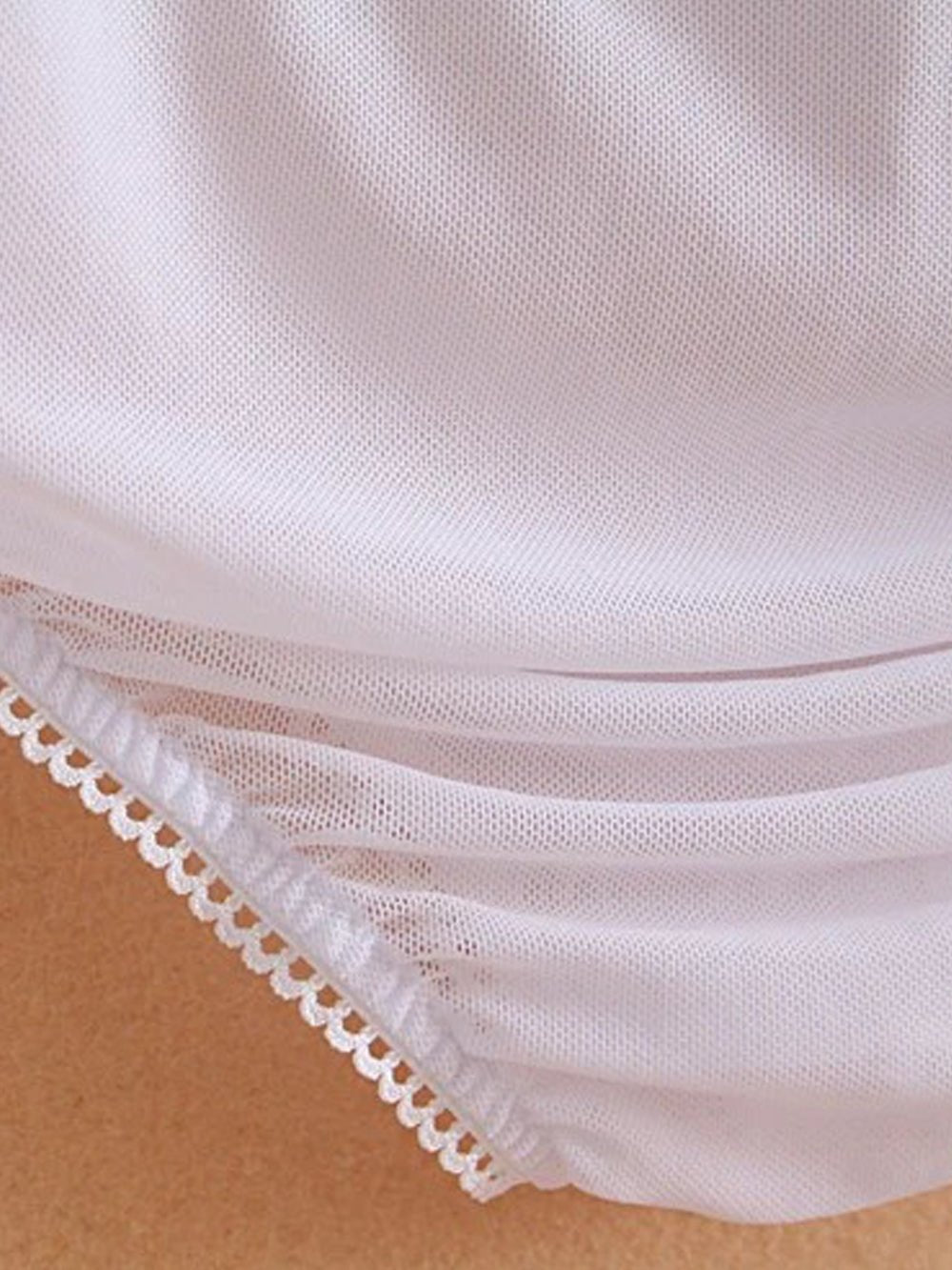 White long-sleeve bodysuit blouse with pointed collar and button front