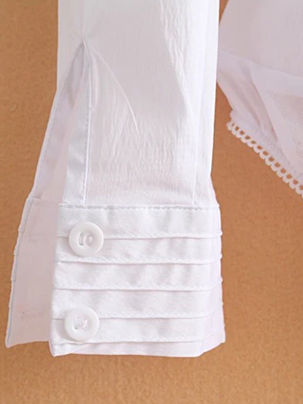 White long-sleeve bodysuit blouse with pointed collar and button front
