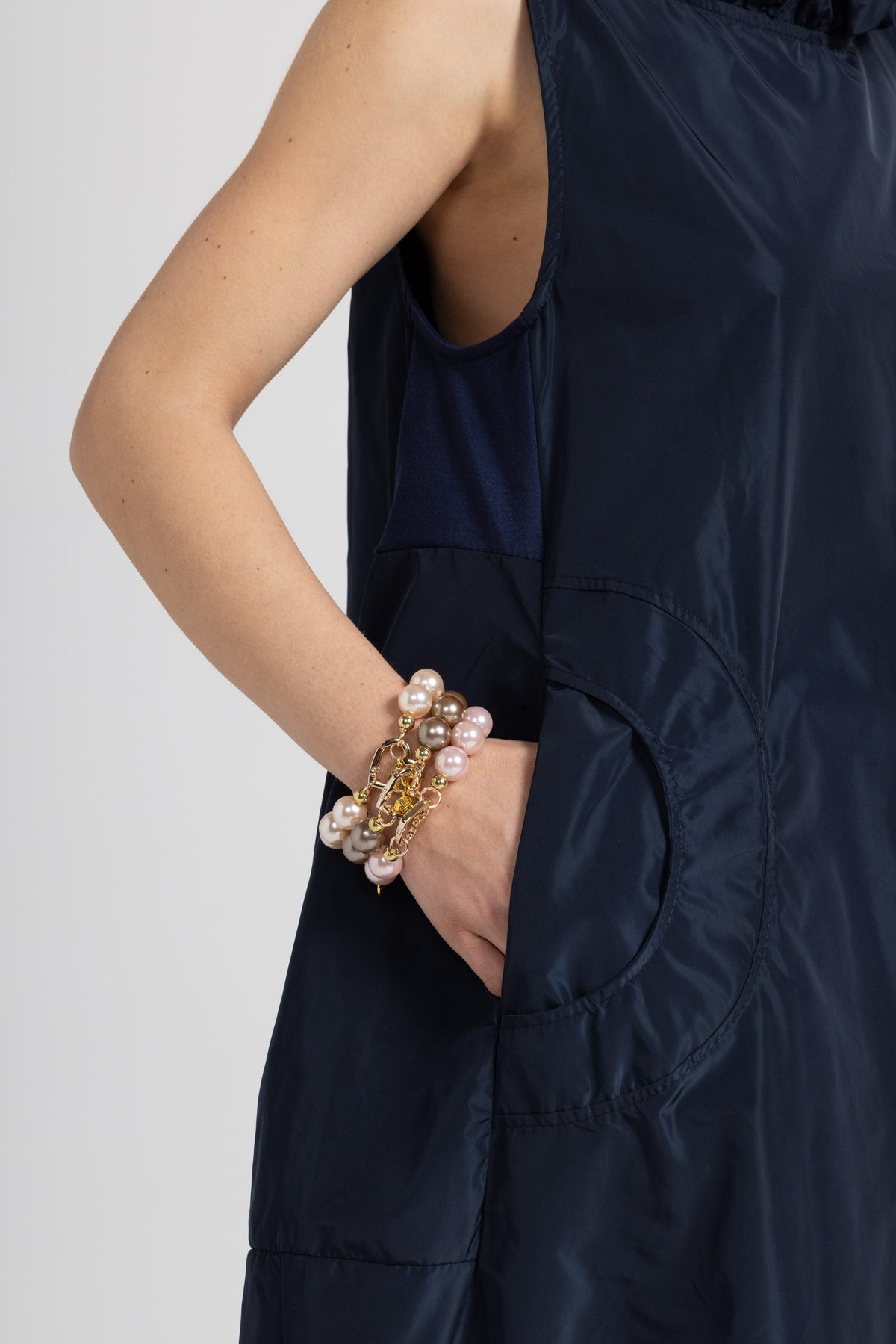Women's deep blue sleeveless maxi dress with gathered neckline and side pockets