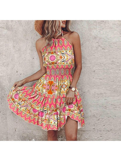 Women's sleeveless halter dress with colourful paisley print and tiered knee-length skirt