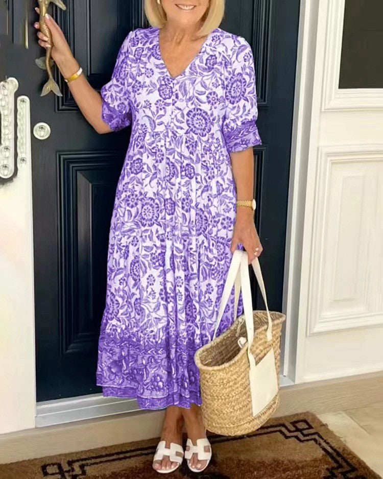 Women's floral V-neck midi dress with three-quarter sleeves and tiered skirt