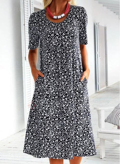 Women's floral midi dress with short sleeves, round neckline and side pockets