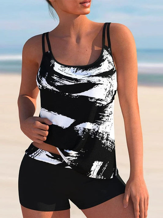 Women's plus size abstract printed tankini swimsuit with double spaghetti straps and black swim shorts