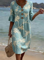 Blue knee-length floral dress with V-neckline, button front and three-quarter sleeves