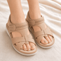 Women's open-toe wedge sandals with crossover straps and ankle buckles
