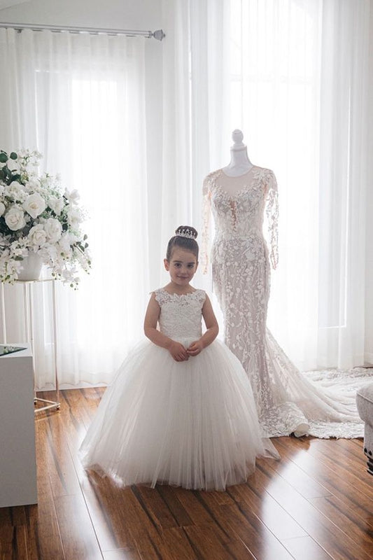 Ivory girls' lace ball gown dress with full tulle skirt, bow back and floral hem