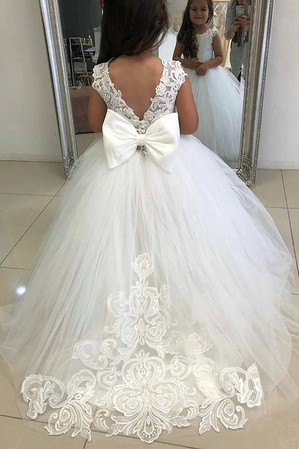 Ivory girls' lace ball gown dress with full tulle skirt, bow back and floral hem