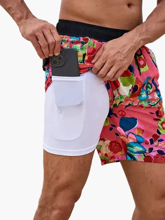 Men's tropical print swim shorts with drawstring waist and inner compression shorts
