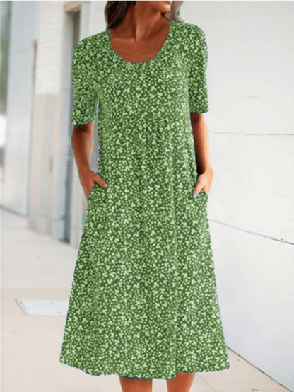 Women's floral midi dress with short sleeves, round neckline and side pockets