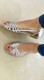 Women's flat sandals with layered straps, open toes and slingback design