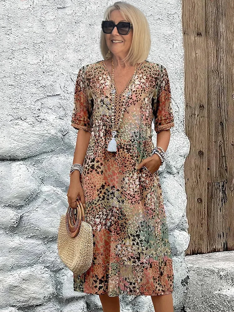 Women's animal print V-neck midi dress with short sleeves and side pockets