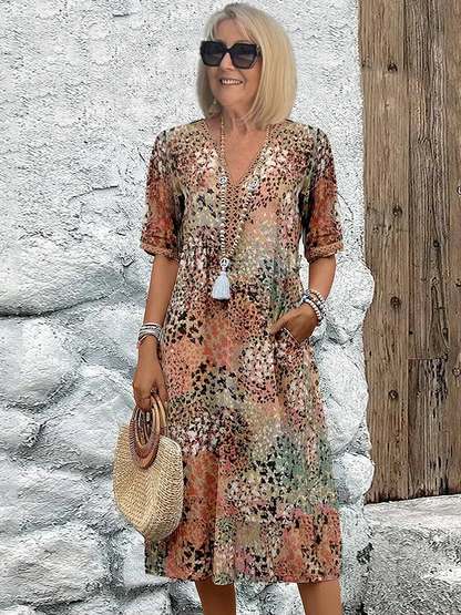 Women's animal print V-neck midi dress with short sleeves and side pockets