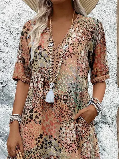 Women's animal print V-neck midi dress with short sleeves and side pockets