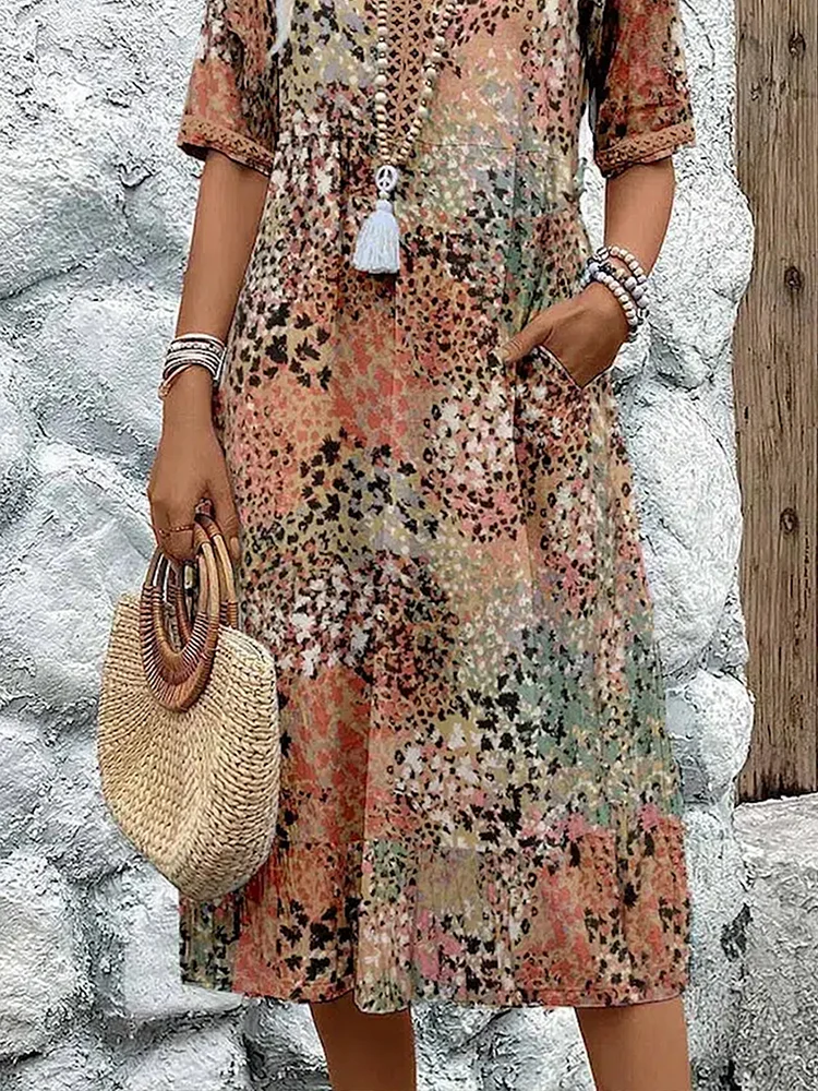 Women's animal print V-neck midi dress with short sleeves and side pockets