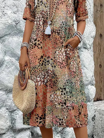 Women's animal print V-neck midi dress with short sleeves and side pockets