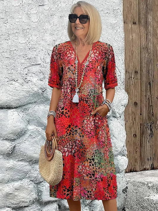 Women's animal print V-neck midi dress with short sleeves and side pockets