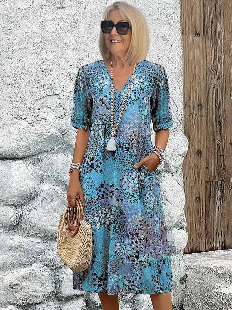 Women's animal print V-neck midi dress with short sleeves and side pockets