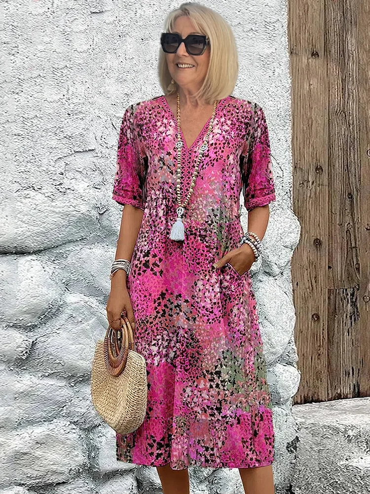Women's animal print V-neck midi dress with short sleeves and side pockets