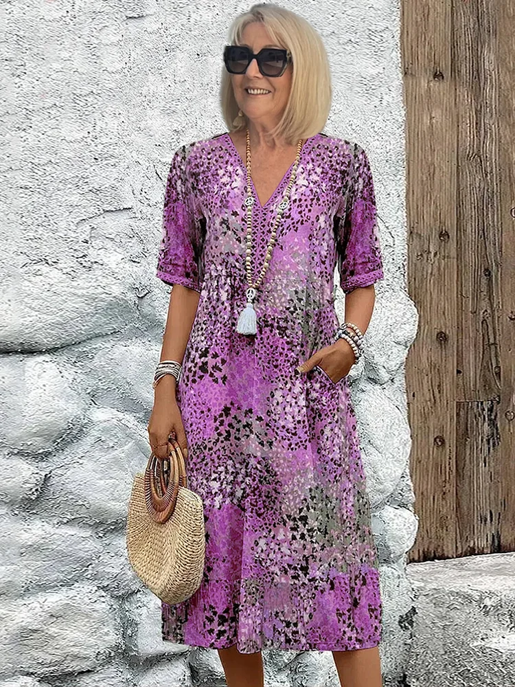 Women's animal print V-neck midi dress with short sleeves and side pockets