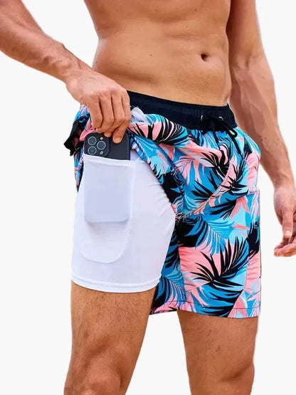 Men's tropical print swim shorts with drawstring waist and inner compression shorts