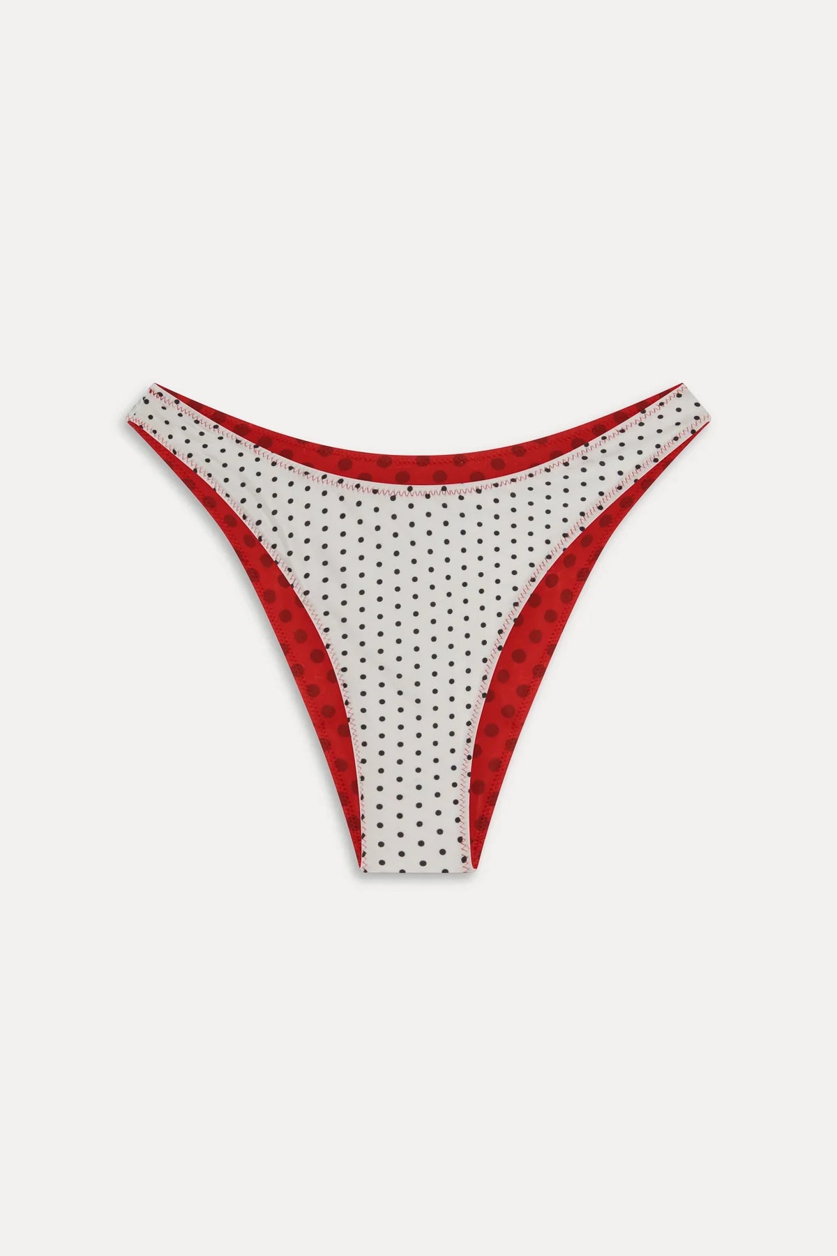 Women's reversible polka dot bikini bottoms with mid-rise brief cut