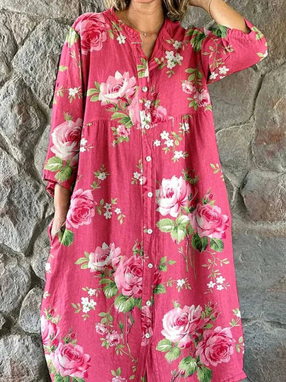 Women's pink floral button-front dress with V-neckline and 3/4 sleeves