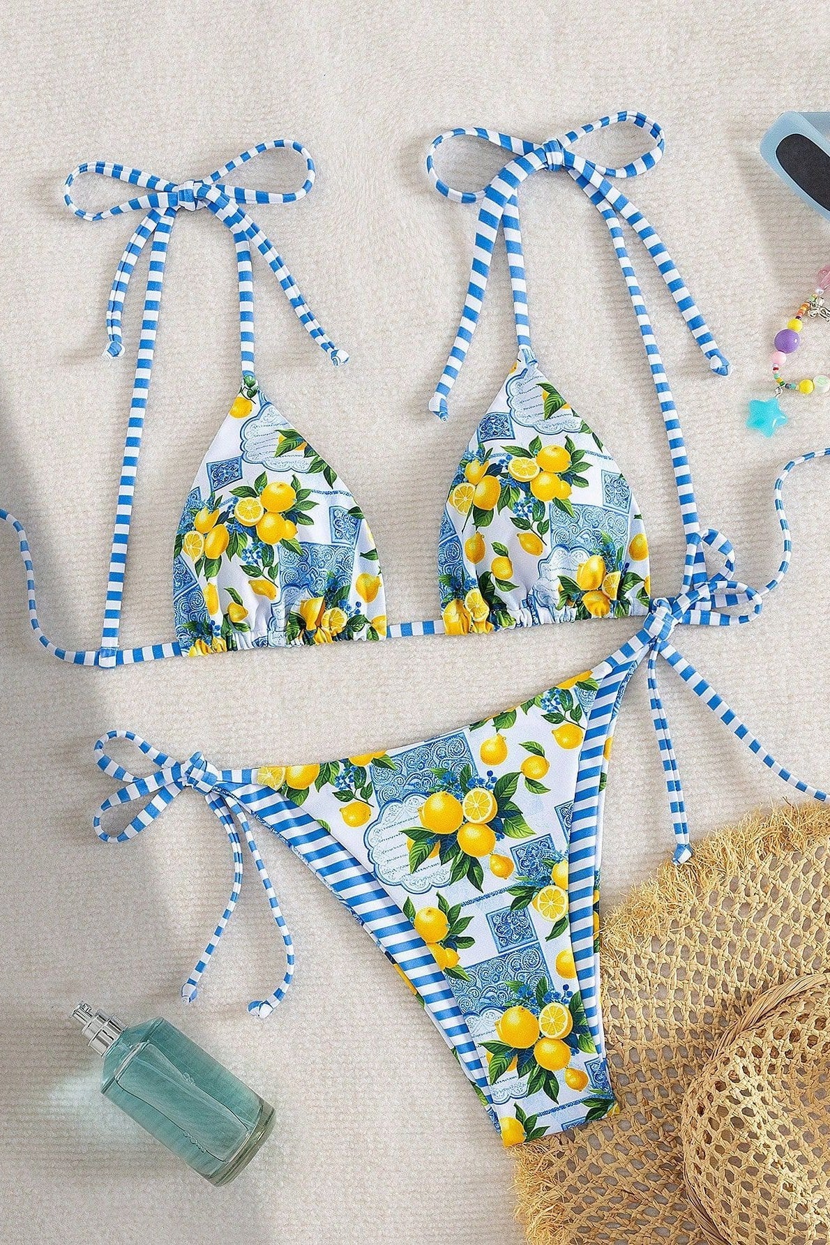 Women's blue lemon print triangle bikini set with tie-side bottoms