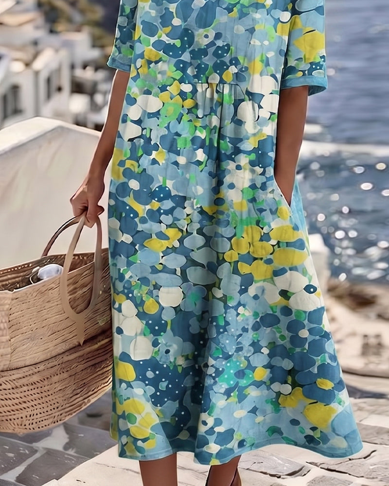 Women's colourful abstract print midi dress with round neckline and 3/4 sleeves