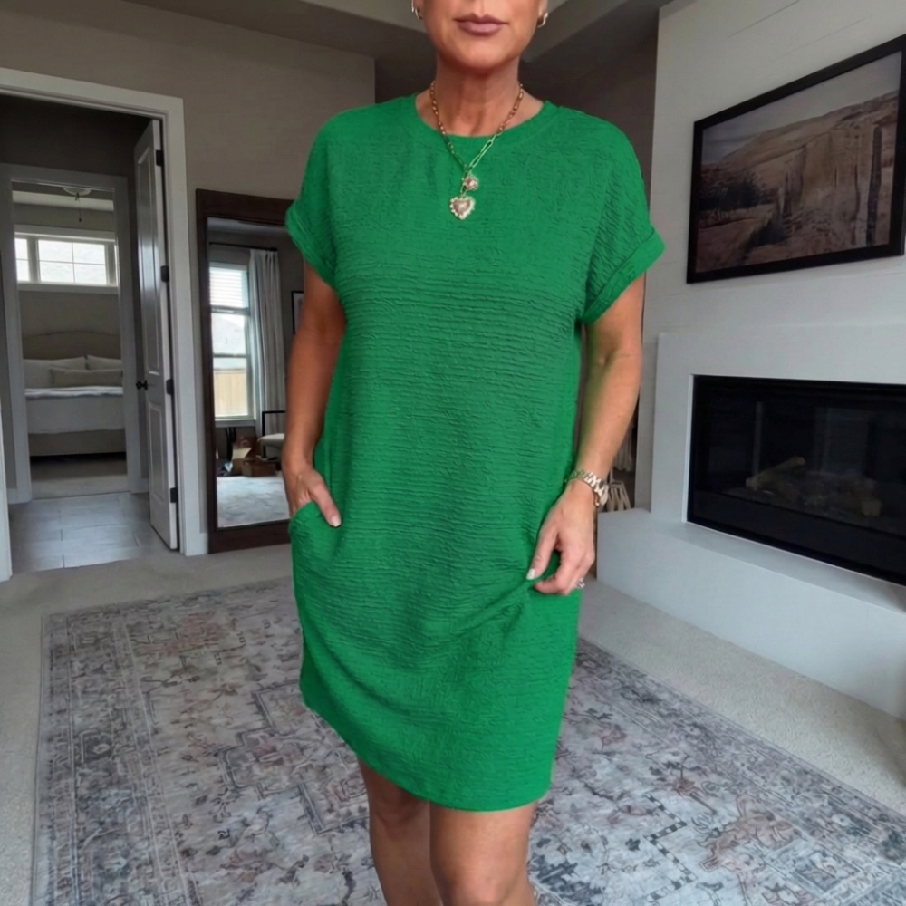 Women's textured short dress with crew neckline, short sleeves and side pockets