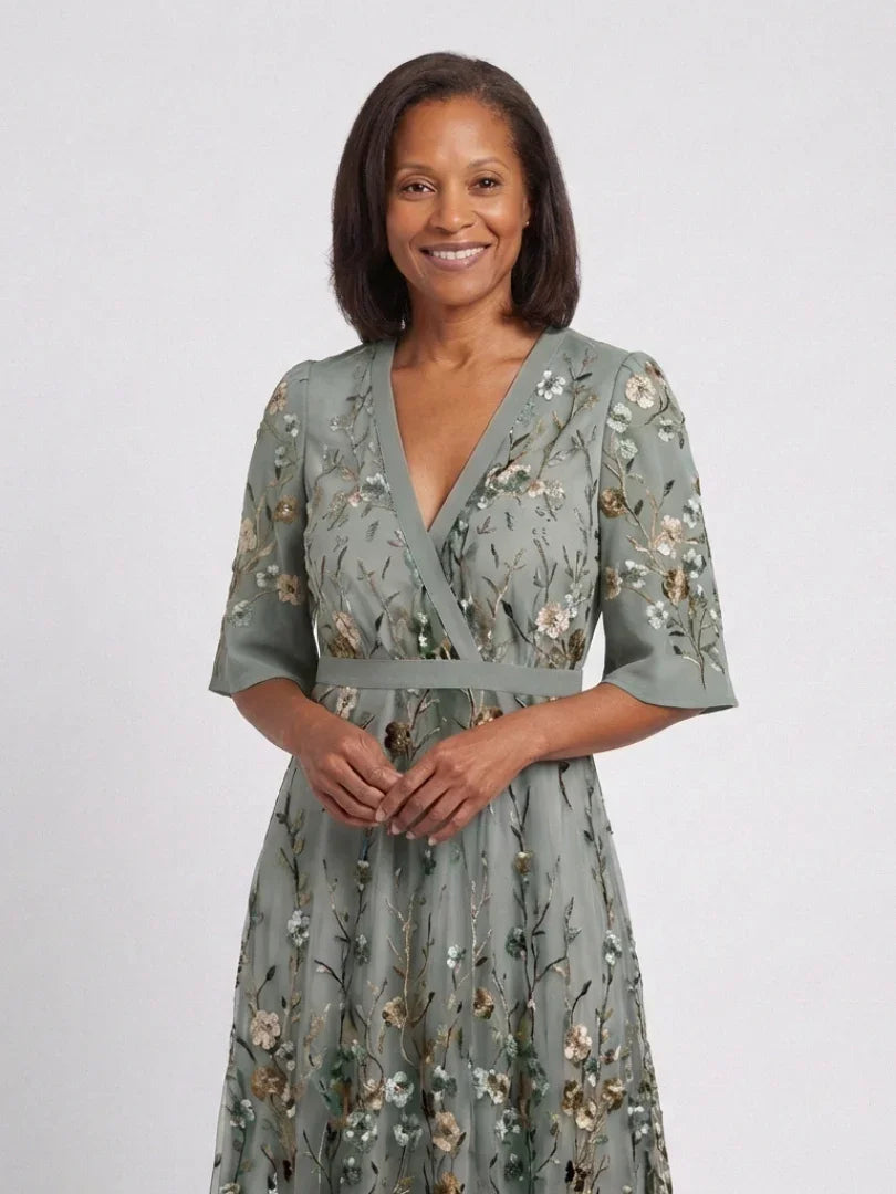 Women's green floral wrap maxi dress with V-neck and short sleeves