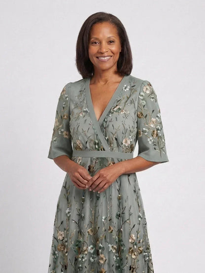 Women's green floral wrap maxi dress with V-neck and short sleeves