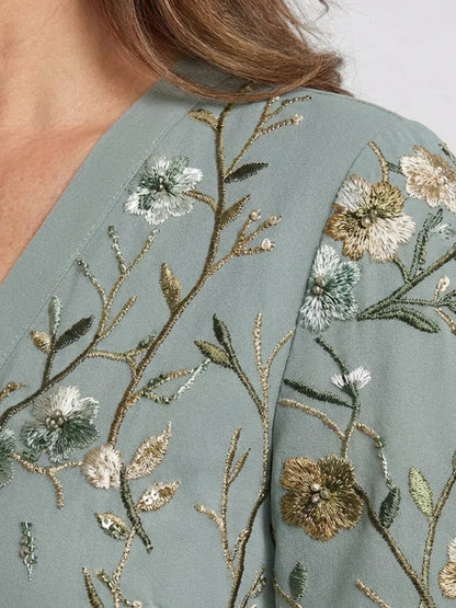 Women's green floral wrap maxi dress with V-neck and short sleeves