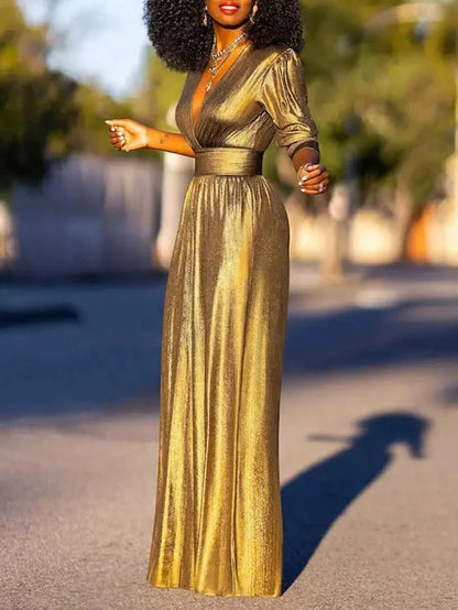 Woman wearing a shiny wide-leg jumpsuit with a deep V-neckline and three-quarter sleeves