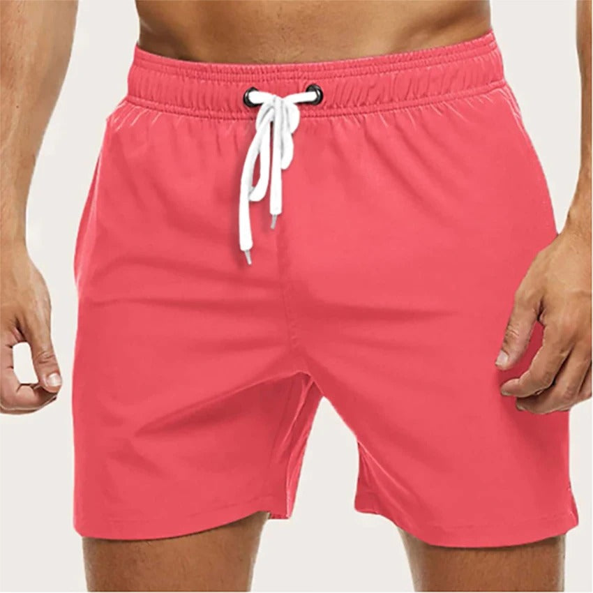 Men's solid swim shorts with elasticated drawstring waist and side pockets