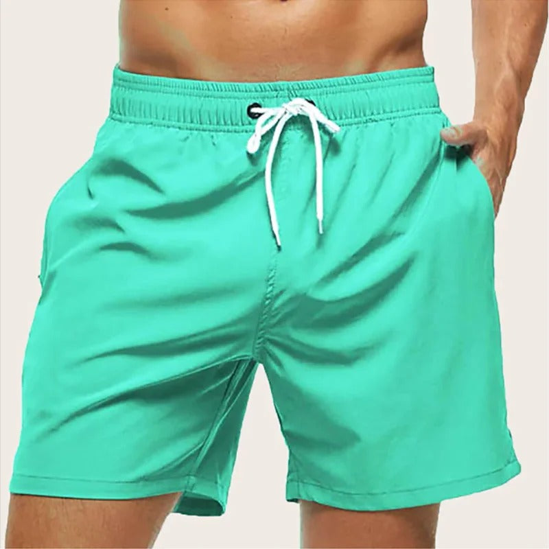 Men's solid swim shorts with elasticated drawstring waist and side pockets