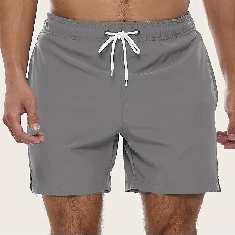 Men's solid swim shorts with elasticated drawstring waist and side pockets