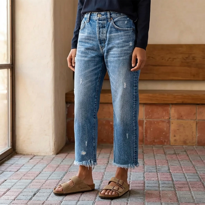 Women's cropped straight leg jeans with faded finish and fringed hems