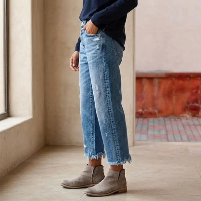 Women's cropped straight leg jeans with faded finish and fringed hems
