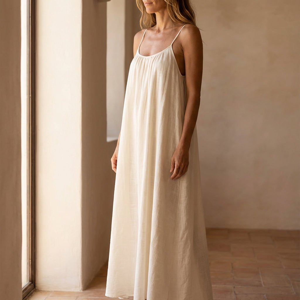 Women's flowing backless maxi dress with V-neckline and spaghetti straps