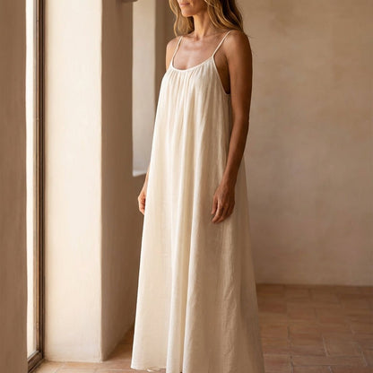Women's flowing backless maxi dress with V-neckline and spaghetti straps